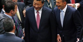 China?s President Xi Jinping is introduced by Australia's Prime Minister Tony Abbott to members of parliament after he spoke at Parliament House in Canberra